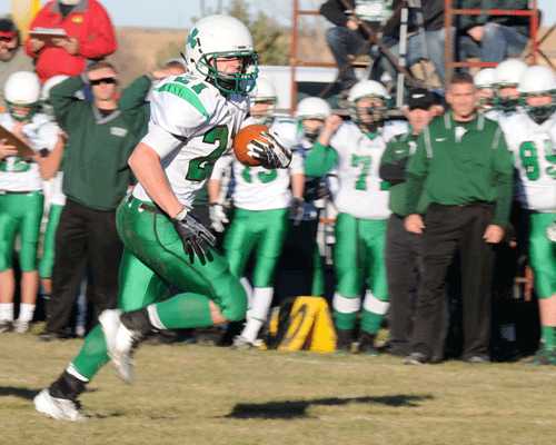 Irish junior Sawyer Kean races towards the end zone on a 20-yard TD run in the first quarter of Sacred Heart's 61-44 playoff victory at Wynot Monday afternoon. Kean finished with 220 yards and four touchdowns on 29 carries. Photo by Jim Langan.