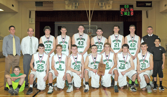  	2014 Pioneer Conference Basketball Tournament Champions – Falls City Sacred Heart Irish – front row, from left: manager Jack Fiegener, Noah Keller, Bailey Witt, Sawyer Kean, Colin Niemeyer, Chaz Dunn, Austin Malone, Henry Arnold, manager Jakob Jordan; back row, from left: Assistant Coach Brian Lemerond, Assistant Coach Adam Santo, Logan Scheitel, Sean Strasheim, Bryant Jorn, Jarod Fiegener, Matt Goltz, Ben Mullins and Head Coach Doug Goltz. Photo by Jim Langan.