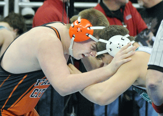 Falls City High School junior heavyweight Jeremy Zimmerman capped a 37-9 season by placing fifth at last weekend’s state wrestling tournament in Omaha. Zimmerman claimed a 4-1 decision over Boys Town’s Luis Pena (30-10) in the battle for fifth place Saturday morning. Zimmerman opened the tournament Thursday morning by pinning Columbus Scotus’ Conner Lusche (photographed) in 2:19. In quarterfinals later, Zimmerman lost to eventual runner-up and second-ranked Andrew Aratani of Scottsbluff in overtime, 4-2. Friday in wrestlebacks, Zimmerman earned 2-1 victories over Jesse Marshall of Beatrice and fifth-ranked Black Chick of Gretna, before losing 3-0 in the consolation semifinals to third-ranked Ronald Trevino of York. Trevino went on to place third. Photo by Jason Schock.