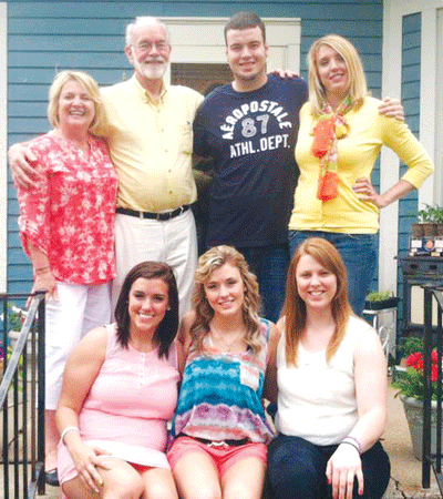Abigail Sailors (seated, center), in a photograph from May of 2013 is pictured with her brother, three sisters and their foster parents at Abigail’s high school graduation party at the Sailors' home. Clockwise from top left are John and Susi Sailors, who Abigail said, “shaped the person I am today,” Josh Murphy, Shelby (Winslow) Rodriguez-Sierra, Madison Winslow and Sydnie Murphy. 