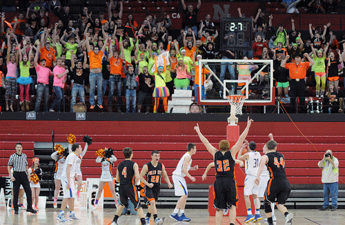 Falls City High School faithful experienced the highest of highs and - 2.7 seconds of game clock later - the lowest of lows last Thursday morning in a heart-wrenching 64-58 overtime loss to eventual state runner-up Wahoo in the Class C1 State Basketball Tournament at Lincoln’s Devaney Center. Senior Mitchell Harling, just like he did in the final seconds of a dramatic district final championship victory over Lincoln Christian 10 days prior, gave the Tigers a 52-50 lead over the Warriors with just :2.7 to go. But Wahoo, celebrating the 25th anniversary of perhaps the greatest comeback in tournament history, saw a full-length inbounds pass get tipped into the waiting arms of Gavin Iverson, who put the ball into the hoop with two-tenths of a second remaining. FCHS went into overtime without Jack Hartman and Ryan Mount, each of whom had fouled out in the fourth, and then lost Harling, too, in the overtime period. Wahoo beat Wayne by 15 Friday to advance to Saturday’s final, where it lost to cross-town rival Neumann. The Tigers finished with a school-record 24 wins to three losses and finished fifth in the final C1 rankings. Photo by Nikki McKim.